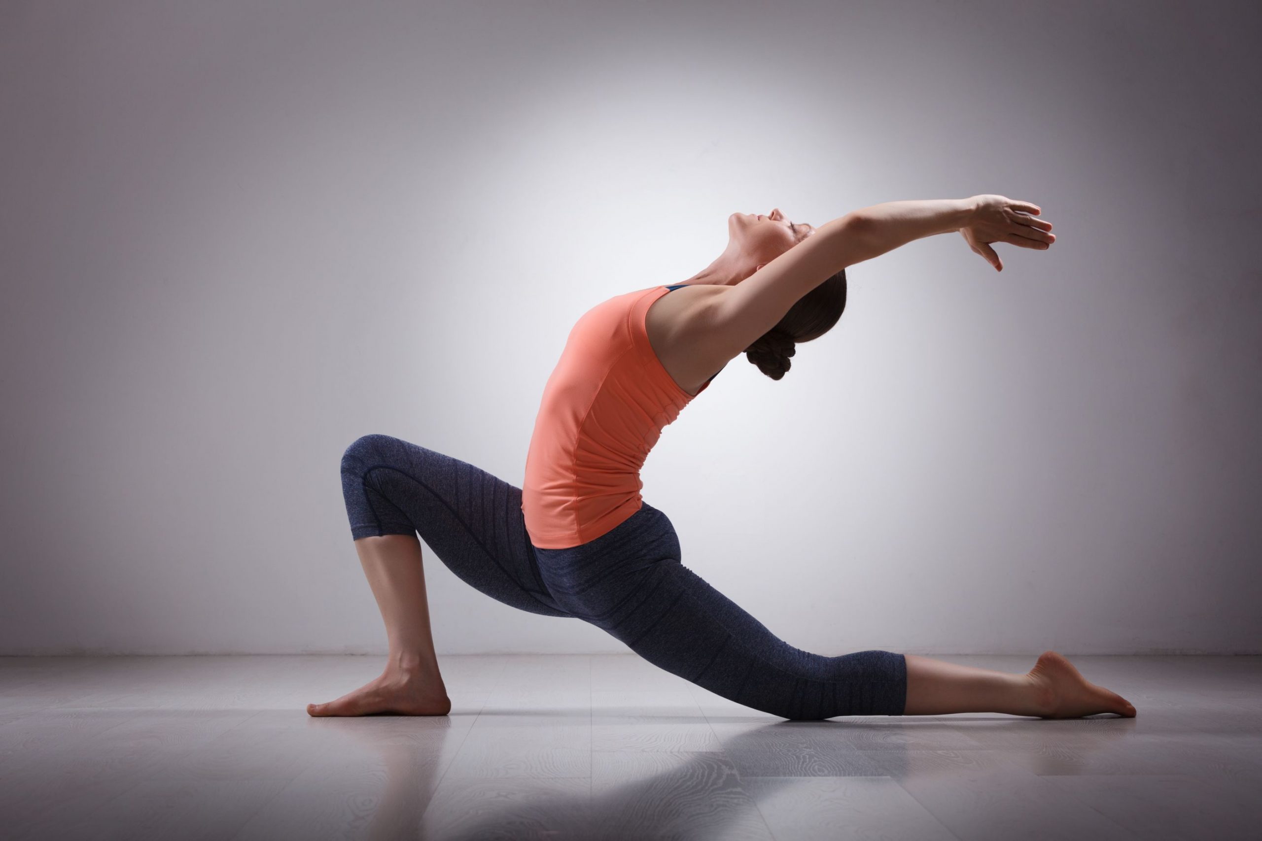 fit-yogini-woman-practices-yoga-asana-anjaneyasana (1)