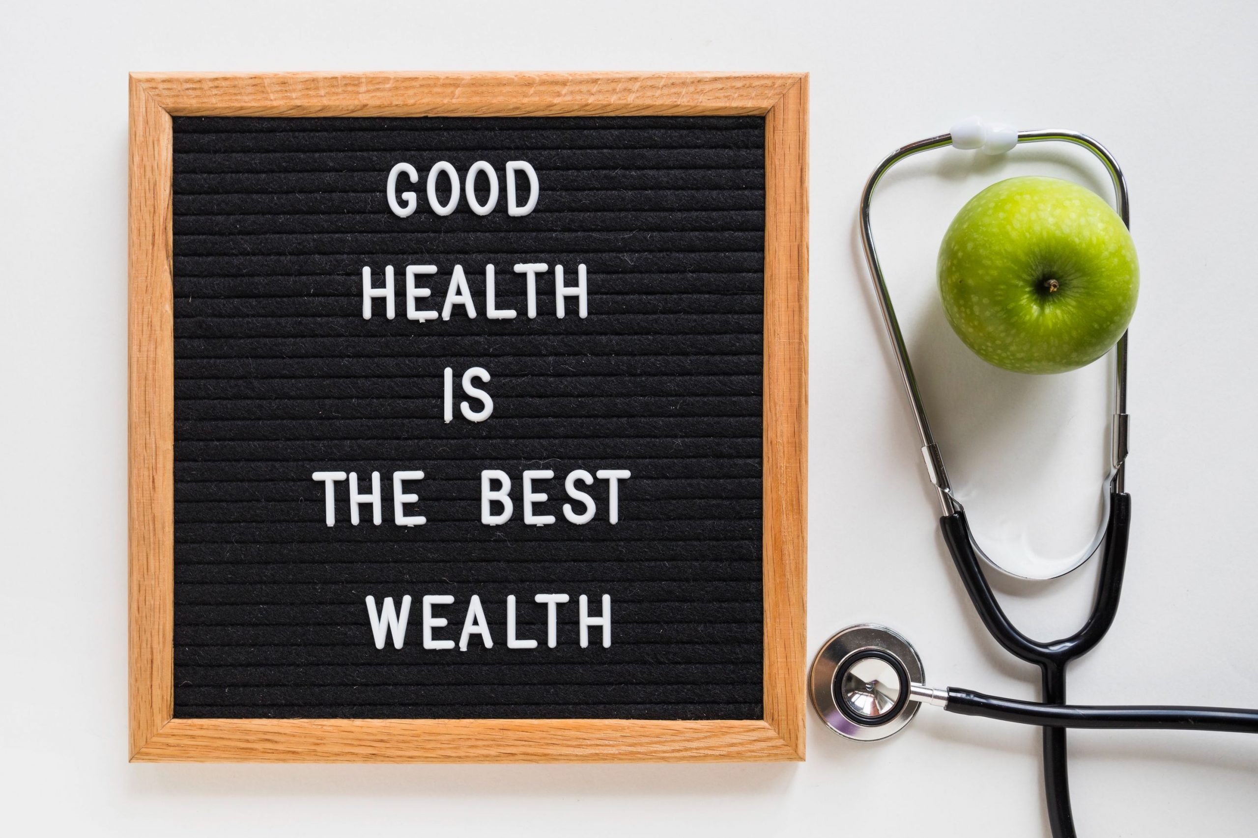 good-health-message-board-with-green-apple-stethoscope-white-background (1)